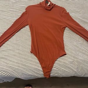 Free people burgundy/burnt orange bodysuit with thumb holes